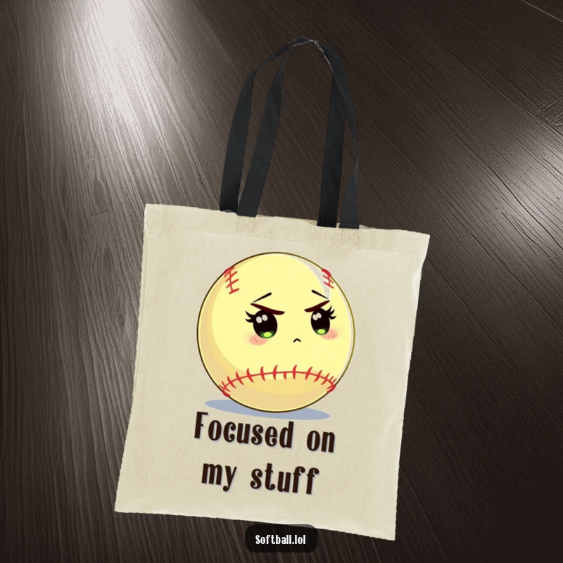 Funny softball tote bag featuring a softball character intently staring at the batter, perfect for carrying essentials.